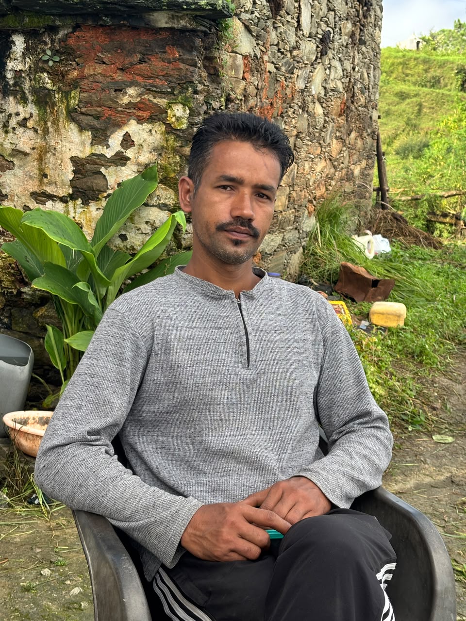 Dinesh Singh Kadakoti sitting outside his home
